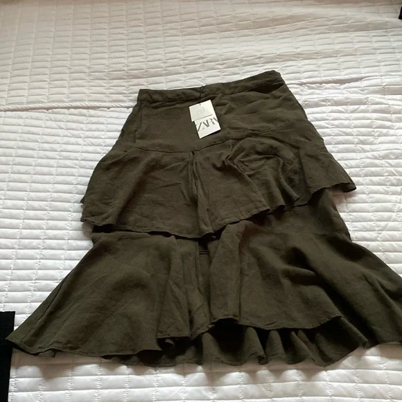 Mid length asymmetrical skirt. Hits to about mid calf asymmetrical